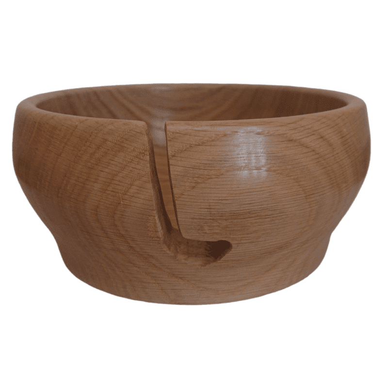 Yarn bowl made from wood, showing where the yarn feeds out