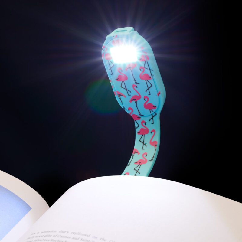Rechargeable reading light designed to fit onto your book as you read. Pink flamingos on blue background
