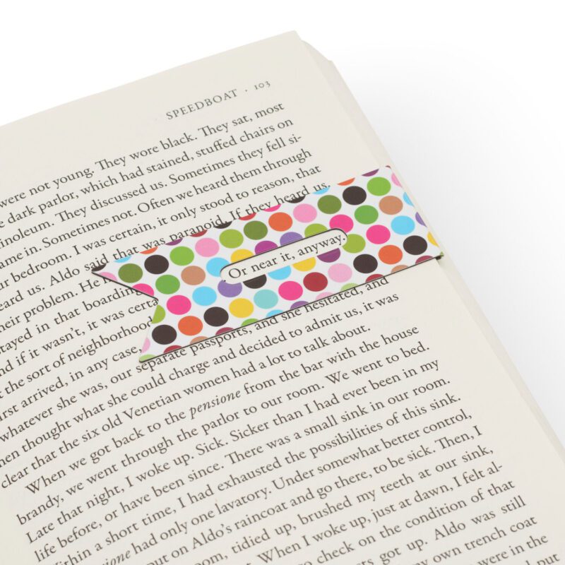 Line marker book mark that you can put over the last line you read to keep a record of where you're up to. Ribbons design. Showing the line marker in use in a book