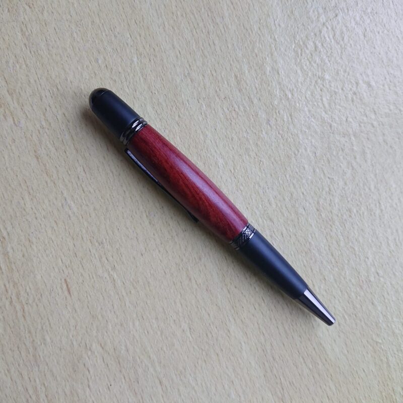 Mahogany handmade wooden pen with wider, broader body and black styling. Retractable tip and elegant design